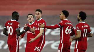 Injury-hit Liverpool keep setting records, 10-man Arsenal hold Leeds