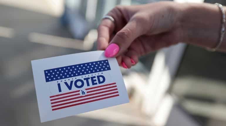 Georgia law kicks off partisan battle over voting rights