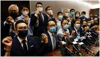 Hong Kong pro-democracy lawmakers resign en masse to protest expulsion of four colleagues