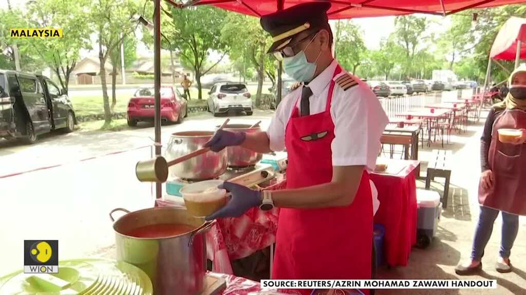 From the cockpit to the kitchen: Grounded Malaysian pilot dons uniform to sell food