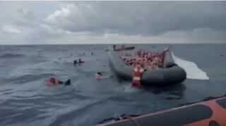 Watch: Migrant mother cries for help as she searches six-month-old in sinking boat