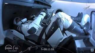 Astronauts board International Space Station from SpaceX capsule