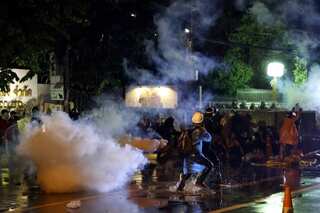 Thai police fires water cannon, tear gas at protesters near Parliament