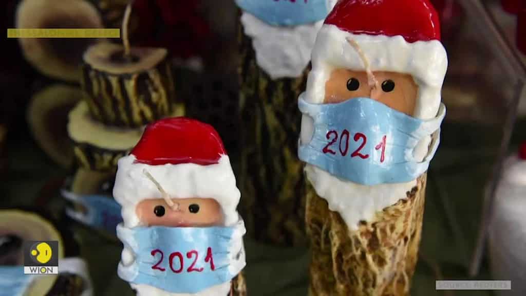 Christmas candles with a twist: In Greece, Santa masked due to coronavirus