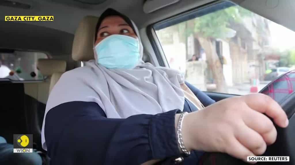 Mother-of-five steers new course as Gaza's first female taxi driver