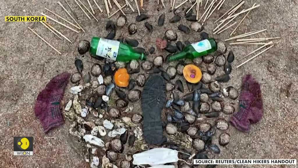 Drone footage shows South Korean artist transforming trash into art on mountains