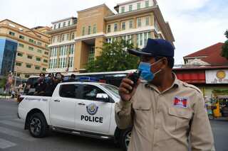 Cambodia begins mass trial of 120 opposition figures