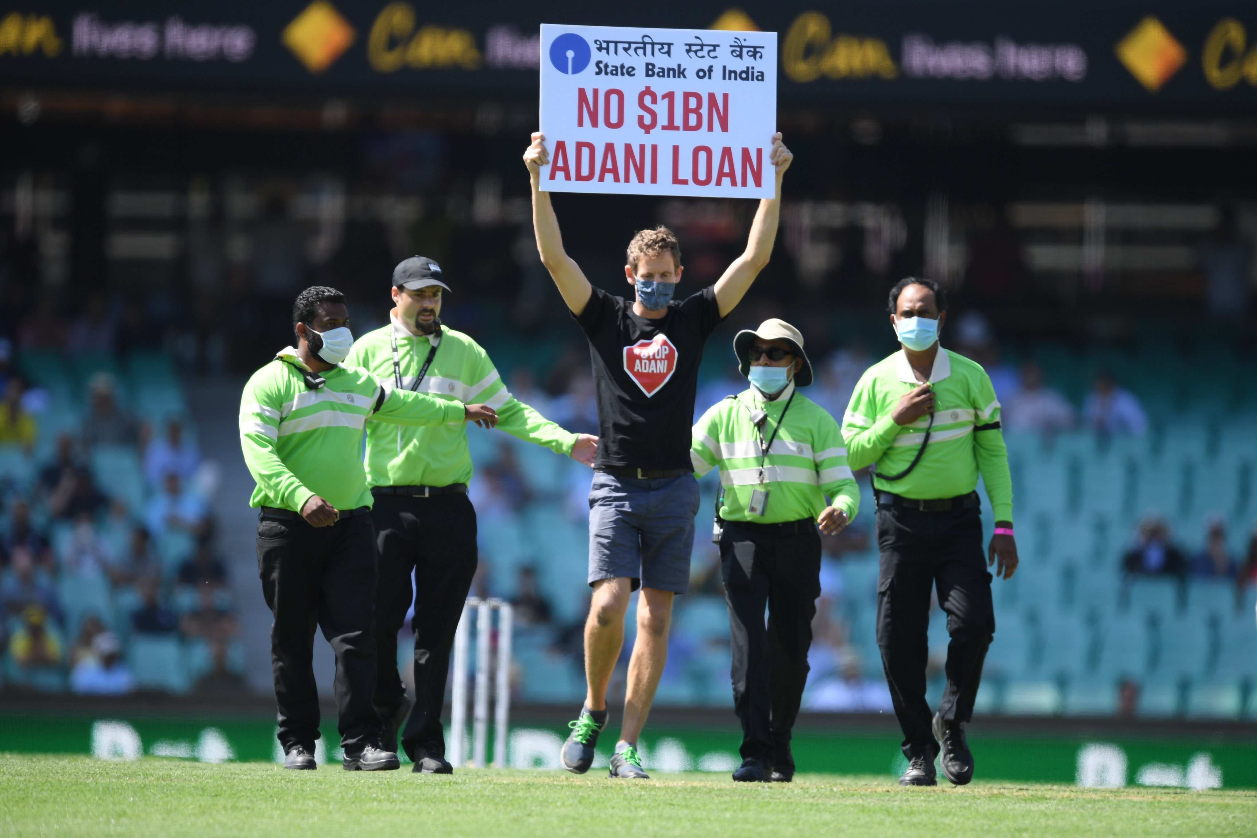 IND vs AUS 1st ODI: ‘No $1BN Adani Loan’ - Protesters enter ground holding banner against Adani Group IND vs AUS 1st ODI: ‘No $1BN Adani Loan’ - Protesters enter ground holding banner against Adani Group