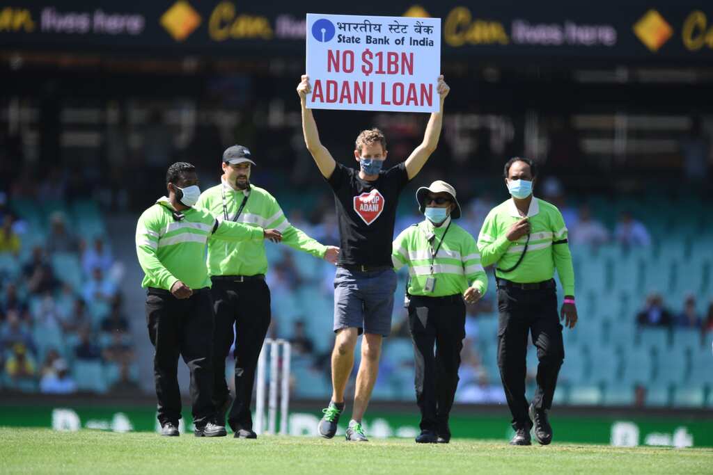 IND vs AUS 1st ODI: ‘No $1BN Adani Loan’ - Protesters enter ground holding banner against Adani Group