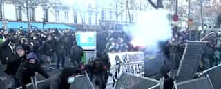 Security officials in France fire tear gas at protesters over police violence