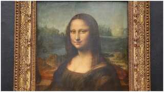 Watch: Man disguised as old lady smears cake on Mona Lisa painting