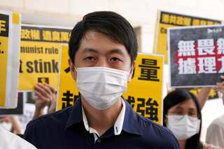 Ex-Hong Kong lawmaker says accounts frozen after he sought exile