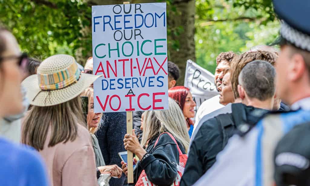 Protest against vaccine as UK begins mass vaccination