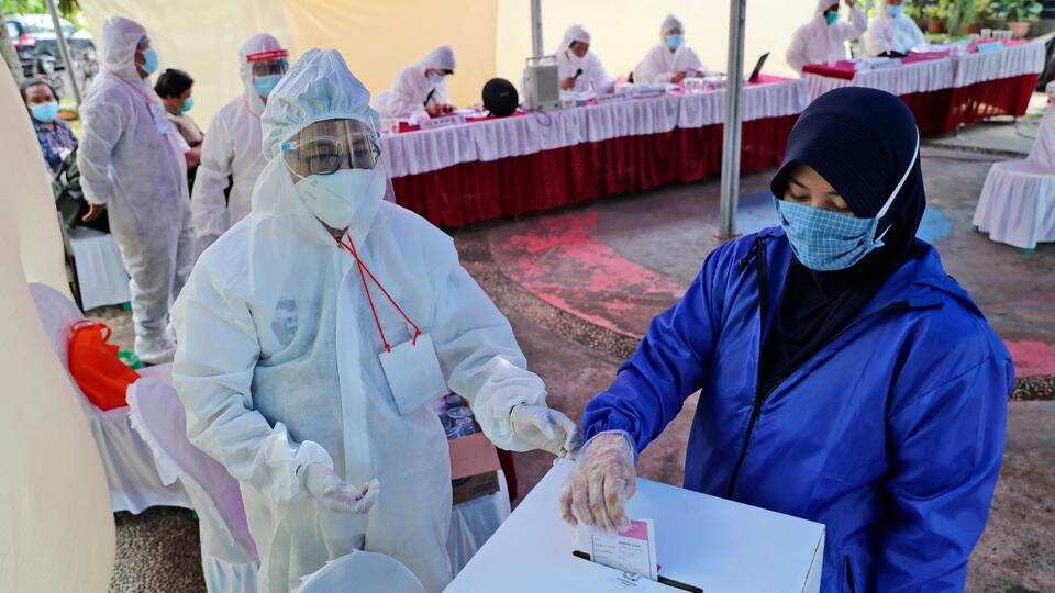 Indonesia holds nationwide poll despite virus warnings