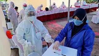 Indonesia holds nationwide poll despite virus warnings