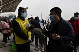 China puts northern city in lockdown after two local infections