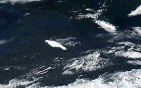 Massive iceberg pivots, breaks near south Atlantic penguin colony island