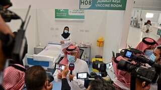 Saudi Arabia halts international flights over new virus variant found in Britain