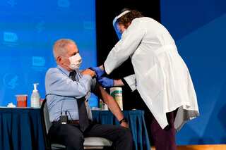 Anthony Fauci receives Covid vaccine in 'symbol' for US