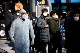 South Korea's Moon under fire for vaccine plans as COVID-19 cases surge