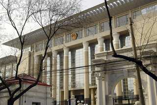 Woman goes on trial in China after 20 years on the run