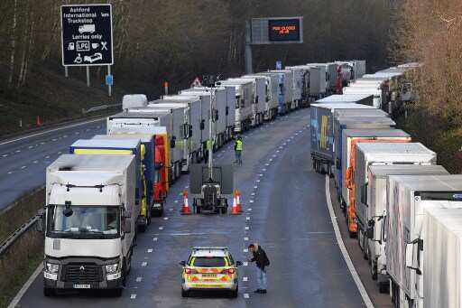 Trucks remain stranded at UK-French border as 3 drivers test COVID-19 positive