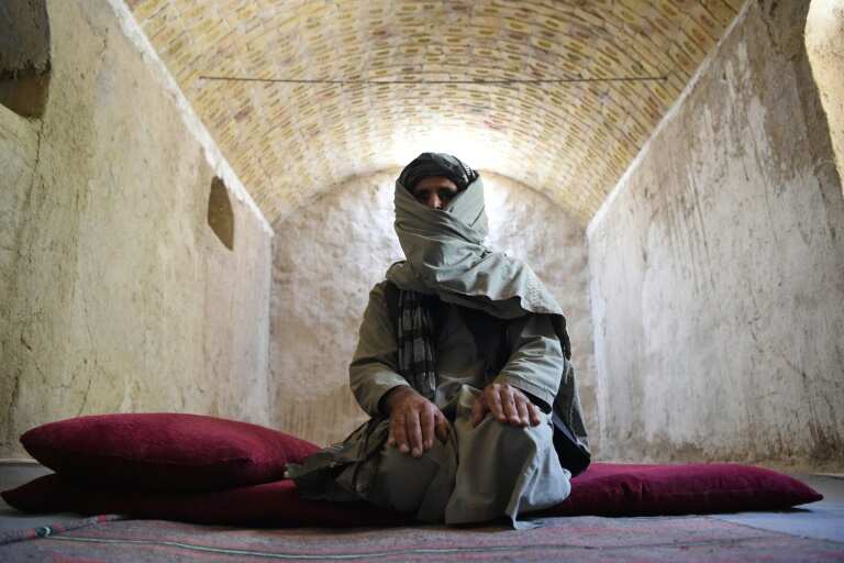 The Afghan police team welcoming back Taliban fighters