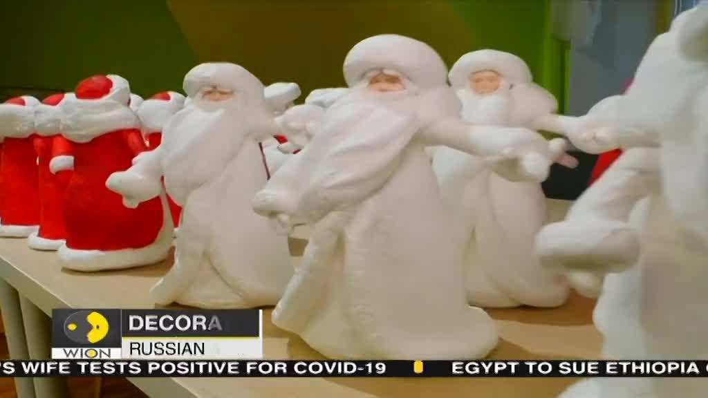 Russian artists decorating new year trees traditionally