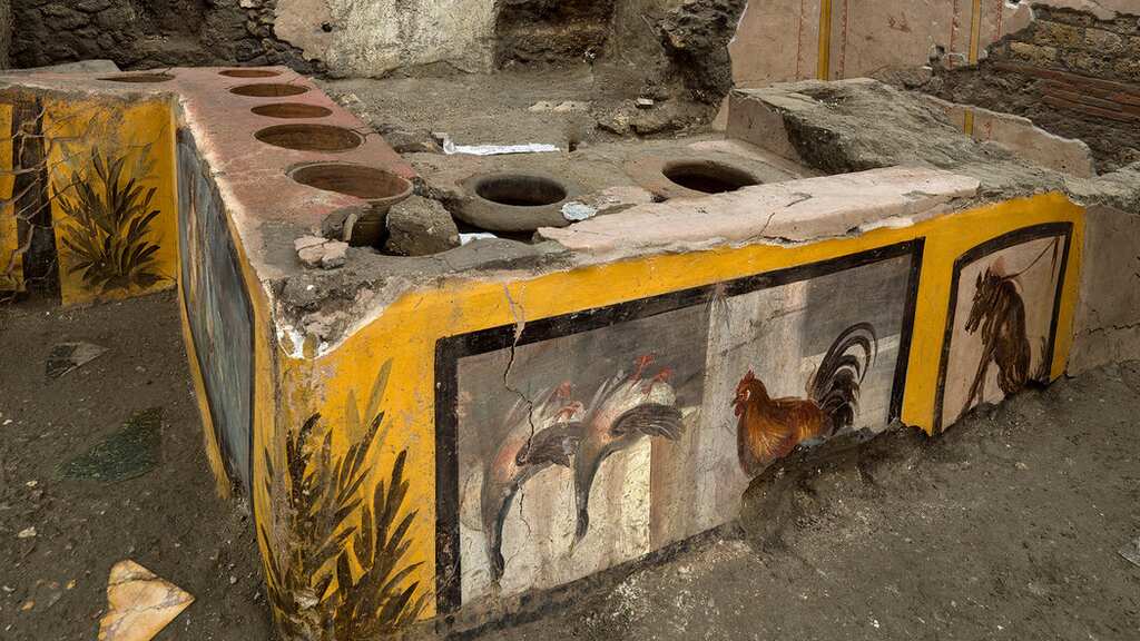 Archaeologists unearth frescoed food shop in the ancient city of Pompeii