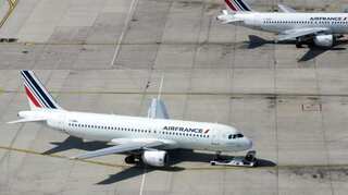 Take the train: French parliament backs cuts in domestic flight routes in climate change fight