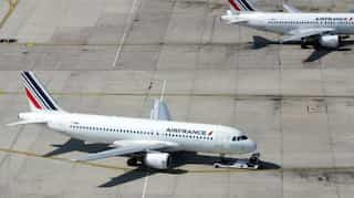 Take the train: French parliament backs cuts in domestic flight routes in climate change fight