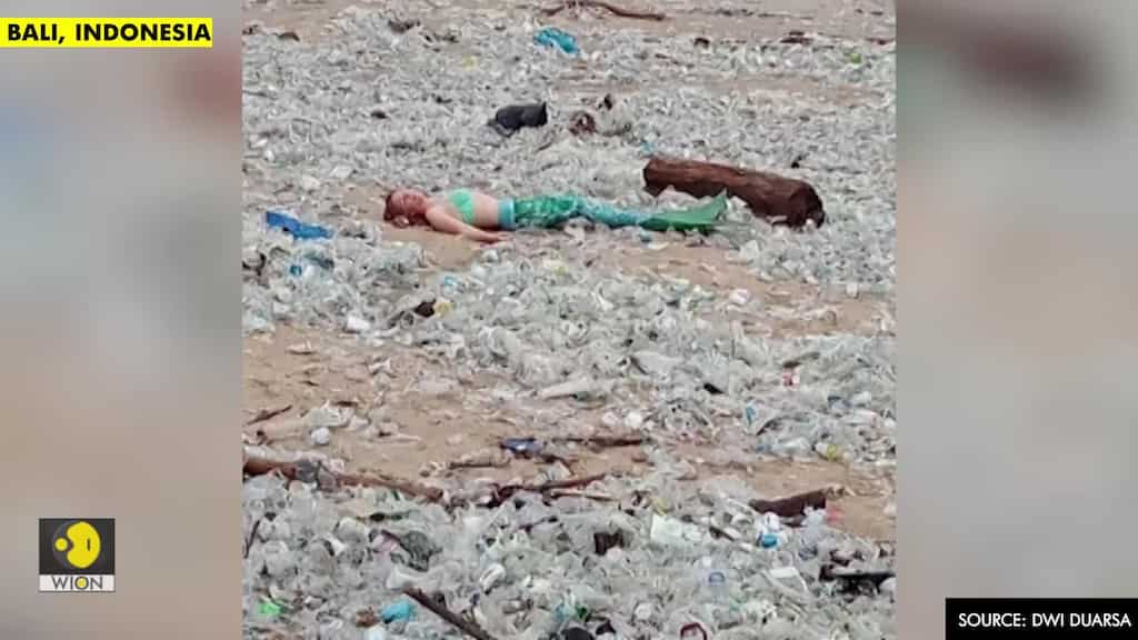"Mermaid" spotted lounging in trash at iconic Indonesian beach