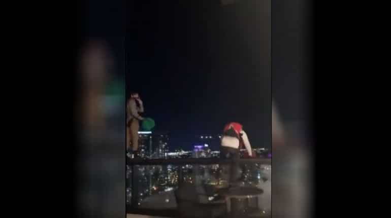 Watch | Men in parachutes jump off 25-floor hotel in Nashville