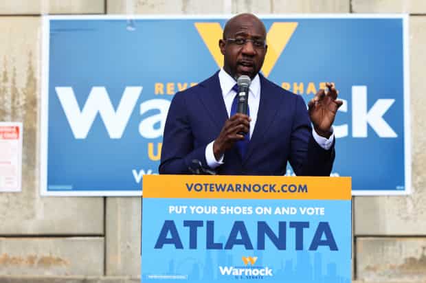 Democrat Raphael Warnock wins one of two crunch US Senate runoffs