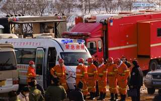China rescuers prepare escape route for trapped gold miners, one confirmed dead