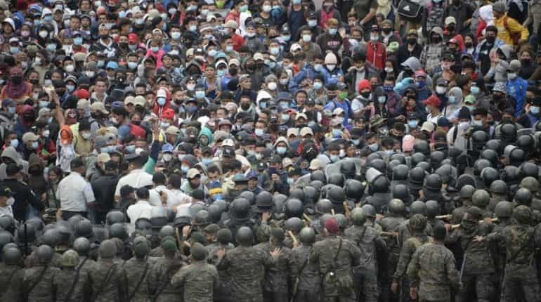 Guatemala police fire tear gas at US-bound migrant caravan Guatemala police fire tear gas at US-bound migrant caravan