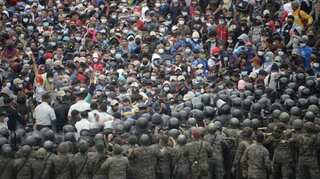 Guatemala police fire tear gas at US-bound migrant caravan