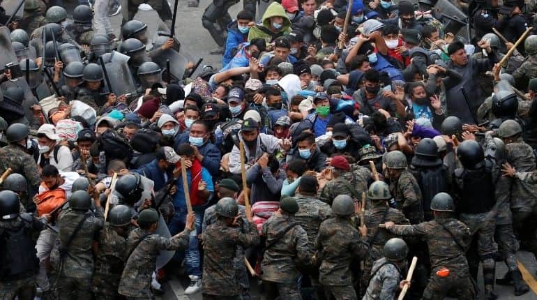 Guatemalan forces clash with migrant caravan, Biden team seeks to halt exodus