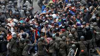Guatemalan forces clash with migrant caravan, Biden team seeks to halt exodus