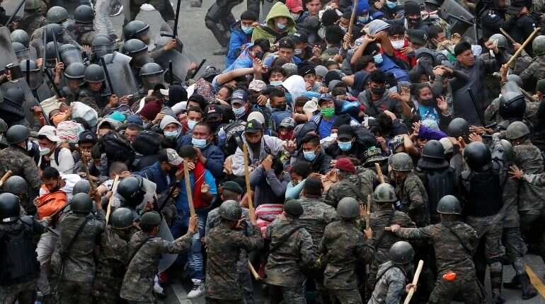 Guatemalan forces clash with migrant caravan, Biden team seeks to halt exodus