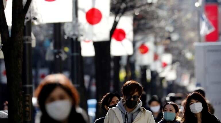 Japan downgrades fourth-quarter GDP as companies scale back spending
