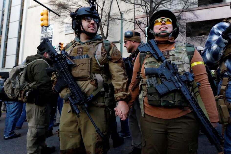 Heavily armed, rival groups rally in Virginia has cops on high alert