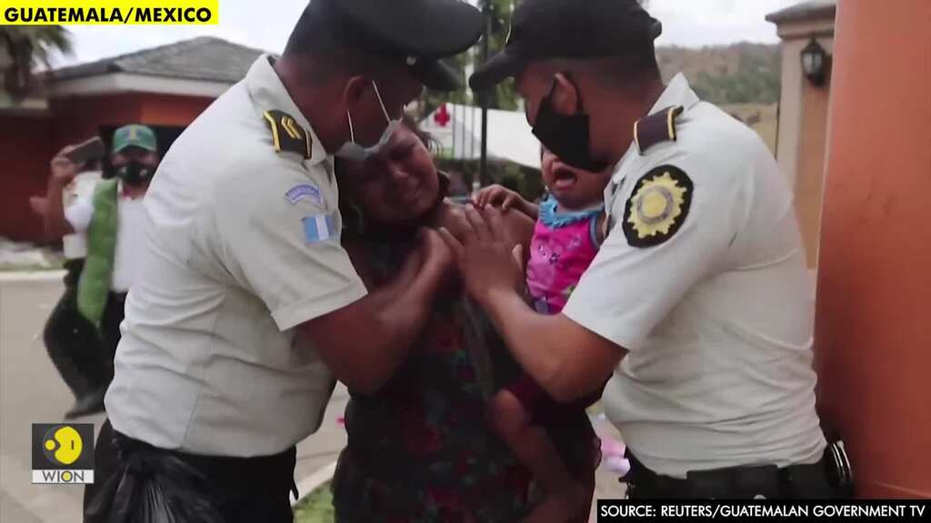 Migrant children wave white flags at Guatemala border after violent showdown with caravan