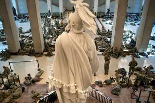 Outrage after troops protecting US Capitol forced to sleep in parking garage