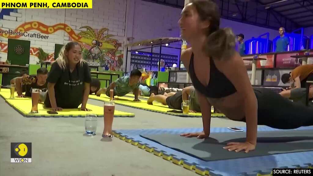 Drinks and downward dog: Cambodian beer yoga class helps ease virus stress