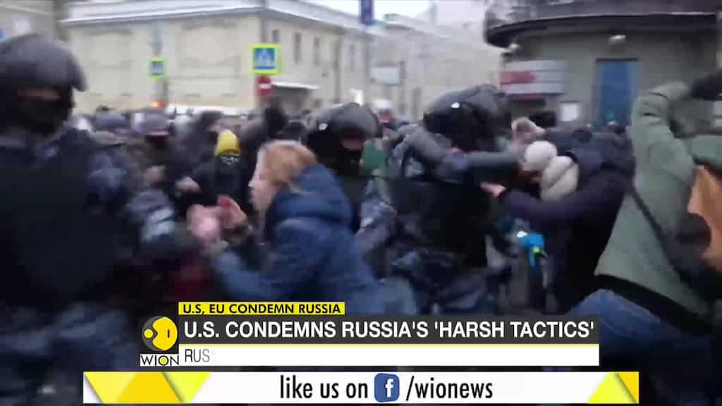 Russian police officers beat protesters at opposition rally