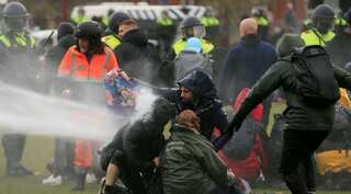 Dutch police clash with anti-lockdown rioters in two cities