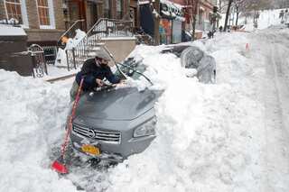 US Northeast digs out after massive snowstorm, two dead