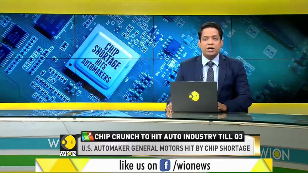 GM hit by chip shortage, to cut production at four plants