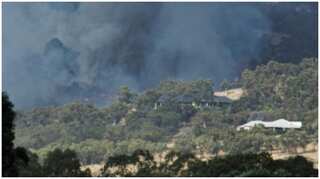 Firefighters bring Perth bushfire under control, but danger remains
